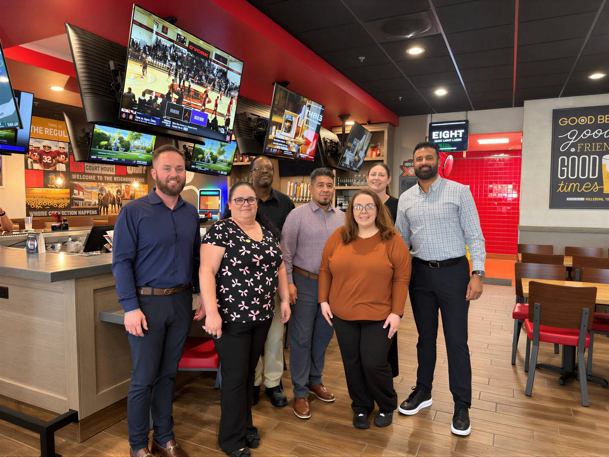 Members of the Anthraper Restaurants team together in a restaurant