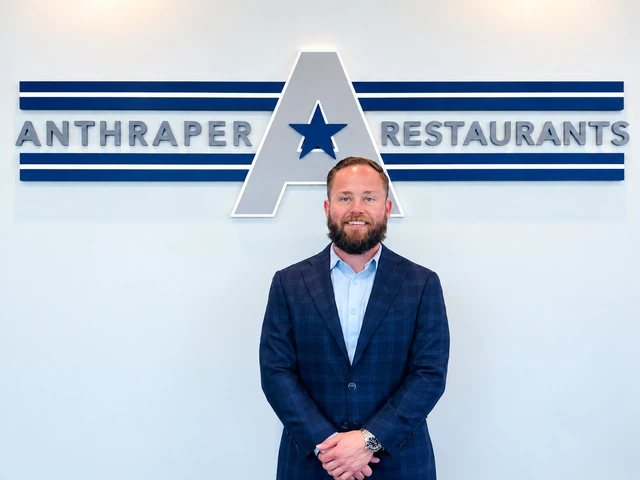 Jim McGarvey standing in front of the Anthraper Restaurants office sign